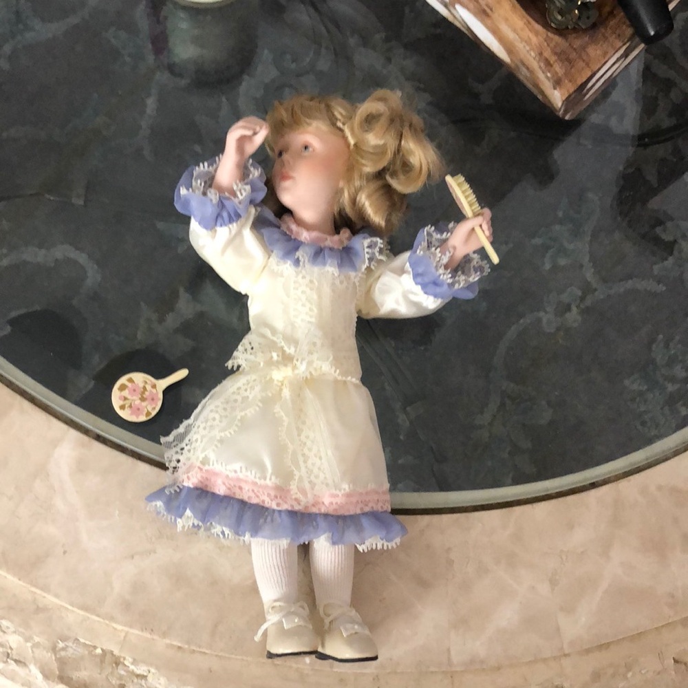 Elegant Porcelain Doll with Cream and Purple Dress